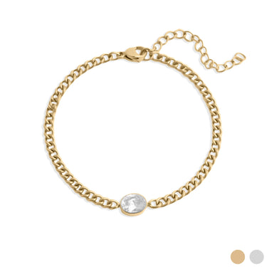 Gold chain bracelet with a clear gemstone on a white background