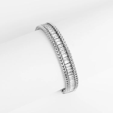 Silver bracelet with clear gemstones on a white background
