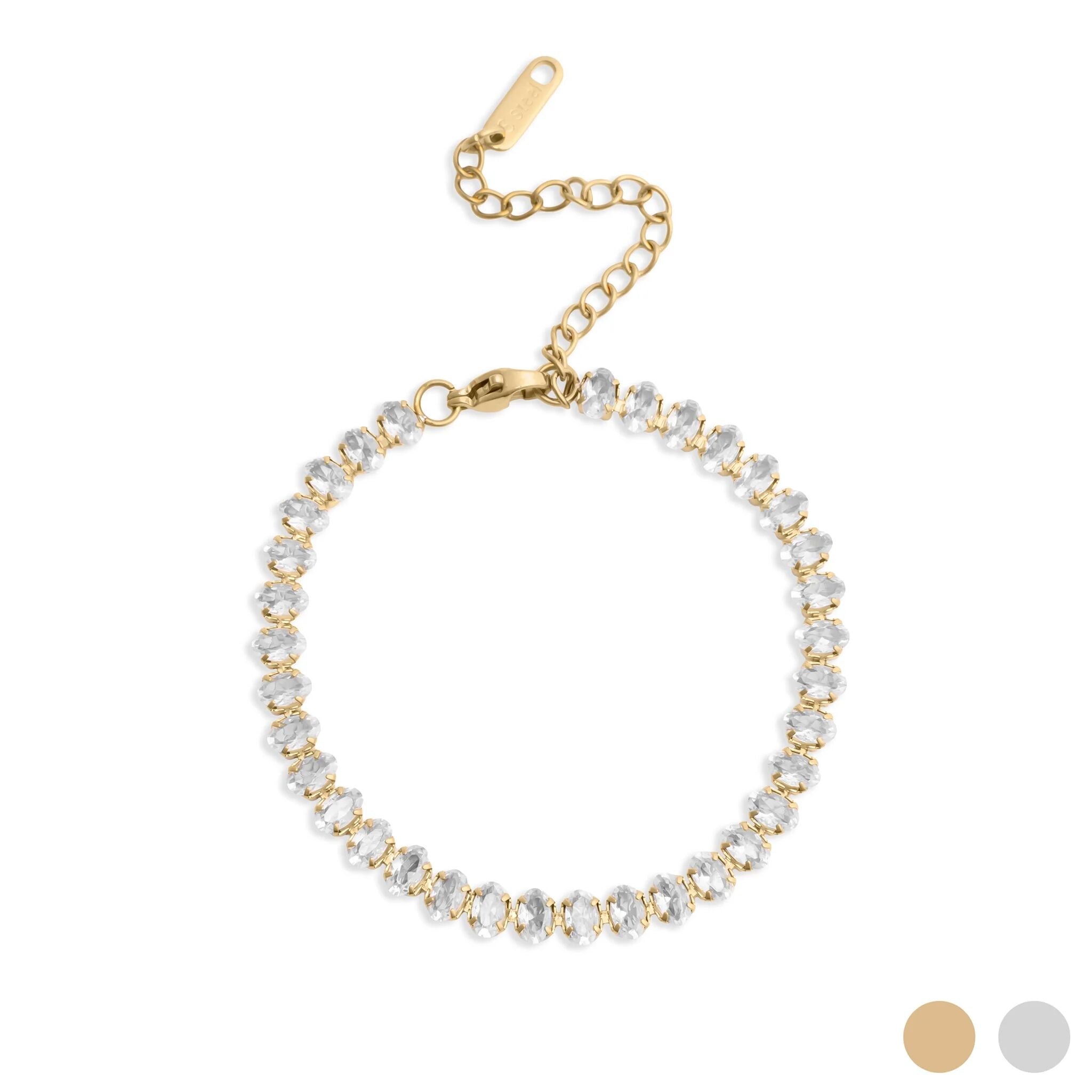 Gold bracelet with clear beads on a white background