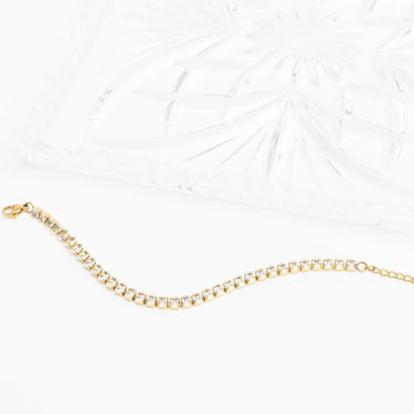 Gold bracelet on a white background