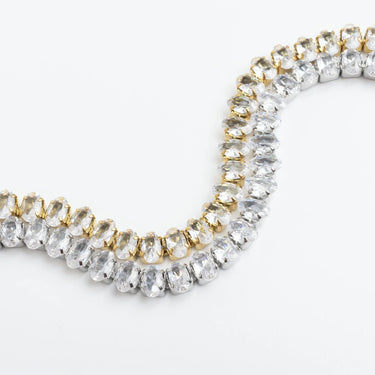 Gold and silver beaded bracelet on a white background