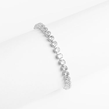 Silver bracelet with heart-shaped charms on a white background