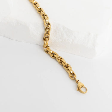 Gold chain bracelet on a white background