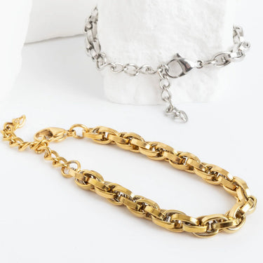 Gold and silver chain necklaces on a white background