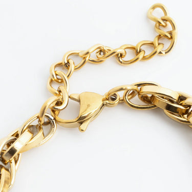 Gold chain bracelet on a white background