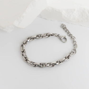 Silver chain bracelet on a white background