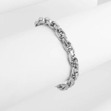 Silver chain bracelet on a light gray background