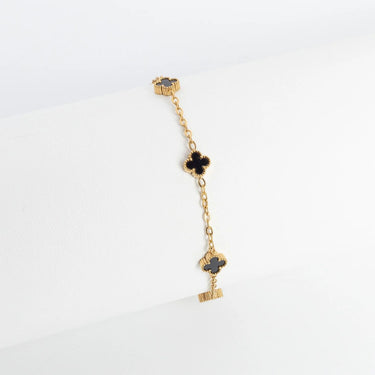 Gold Small Floral Motif Bracelet  with black heart charms on a white background
