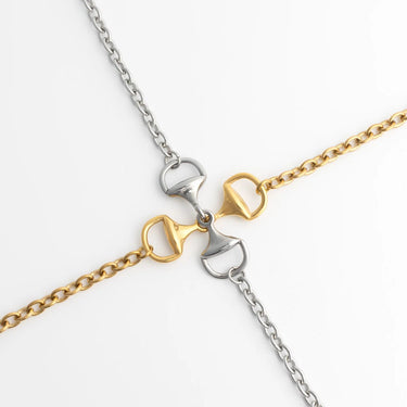 Two gold and silver chain Horsebit Bracelets on a white background