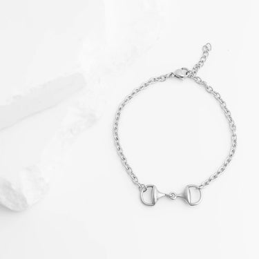 Silver bracelet with a horse bit design on a white background