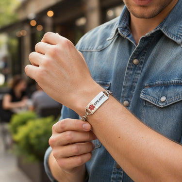 Person wearing a medical alert bracelet outdoors
