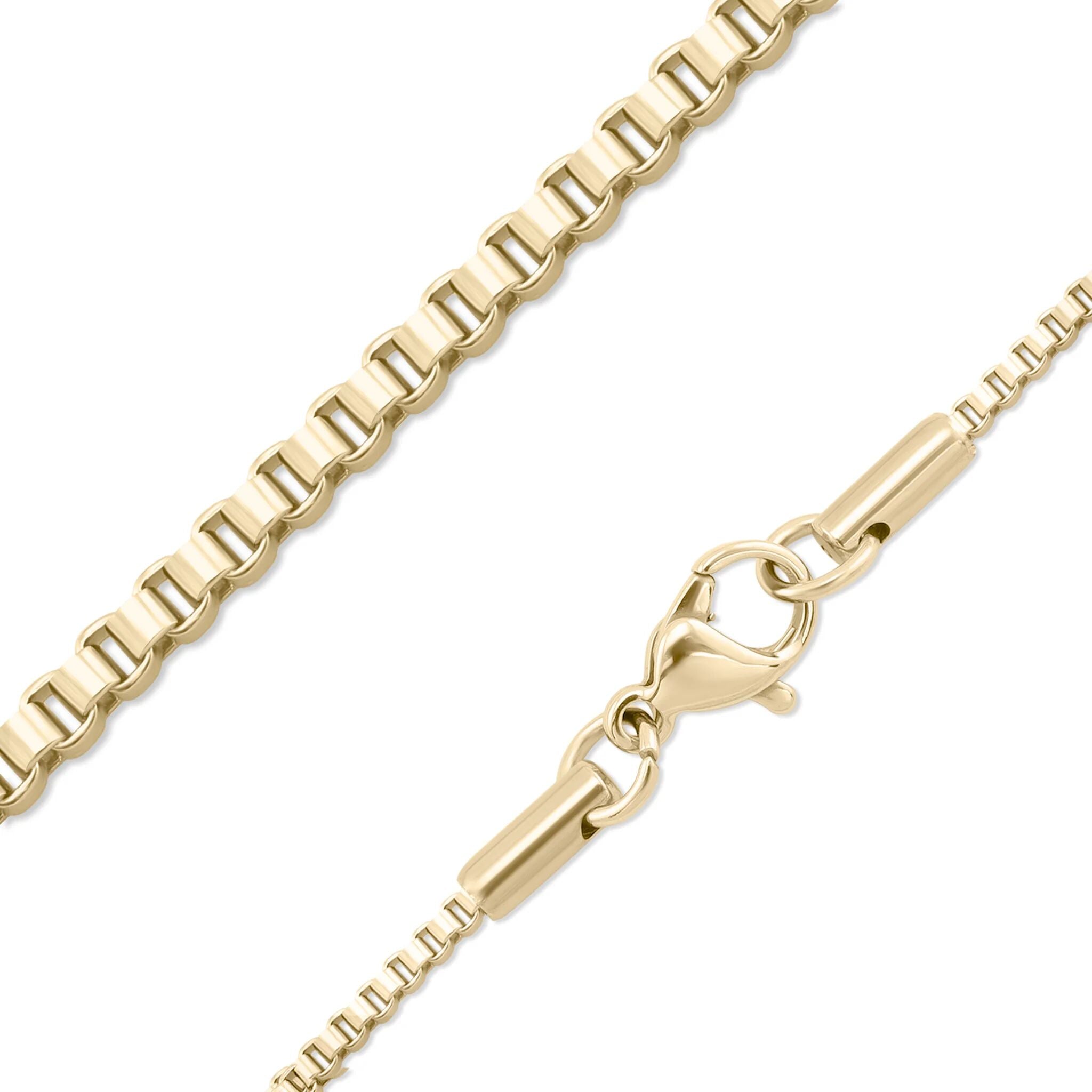 Gold chain necklace with a clasp on a white background
