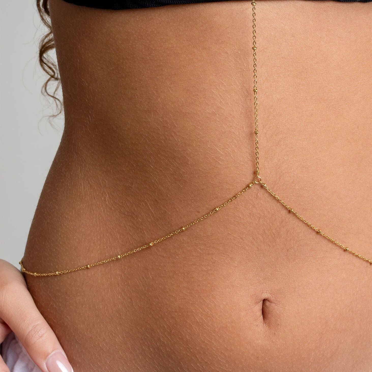 Gold Full Body Chain Satellite worn by a person on a neutral background