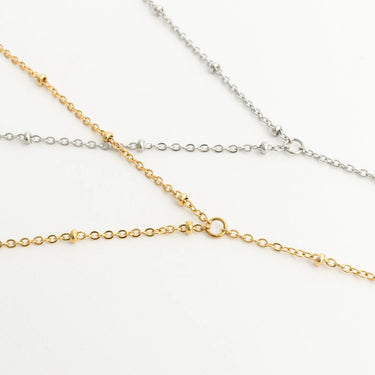 Three gold and silver Full Body Chains Satellite on a white background