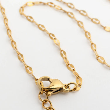 Gold Lip Belly Chain with clasp on a light gray background