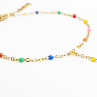 Gold Multi Color Hand Chain with colorful beads on a white background