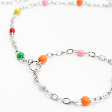 Silver Multi Color Hand Chain with colorful beads on a silver chain against a white background