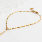 Gold Lip Hand Chain on a light gray background