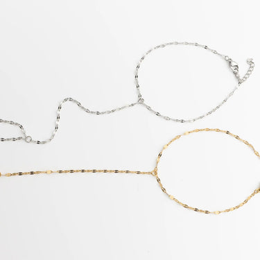 Two gold and silver Lip Hand Chain on a white background