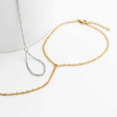 Gold and silver Singapore Hand Chain on a white background