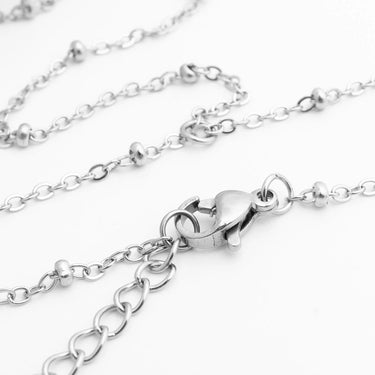 Silver Satellite Hand Chain with clasp on a white background