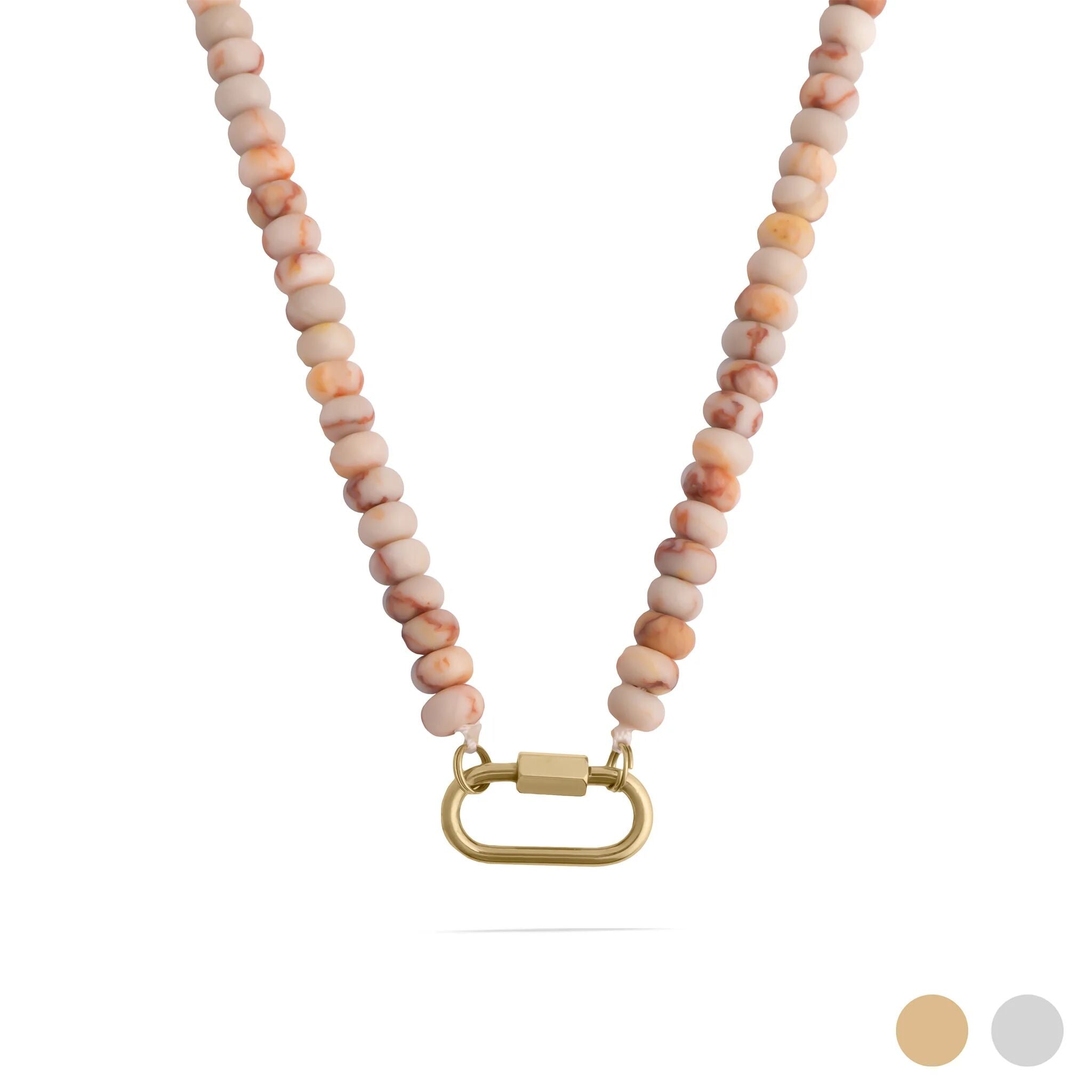 Necklace with pink and beige beads and a gold clasp on a white background