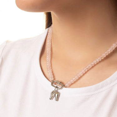 Glass Bead Carabiner necklace with a silver charm worn by a person on a white background