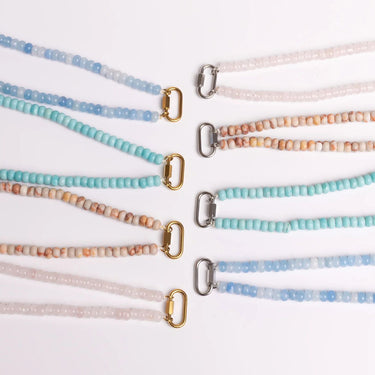Set of beaded necklaces with various color combinations on a white background