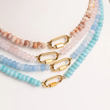 Set of beaded necklaces with gold clasp on a white background