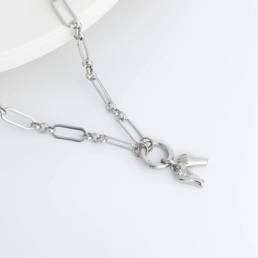 Silver chain bracelet with a clasp on a white background