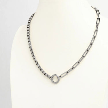 Silver chain necklace on a mannequin head with a white background