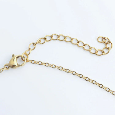 Gold chain necklace on a white background