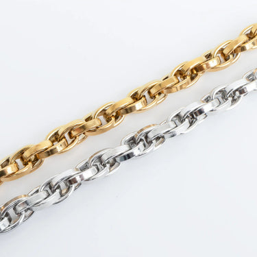 Gold and silver chain links on a white background