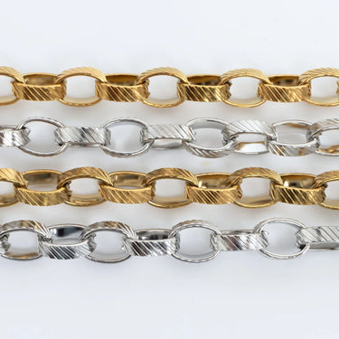 Three gold and silver chain necklaces on a white background