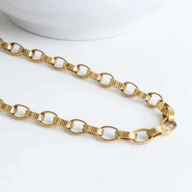 Gold chain on a white background