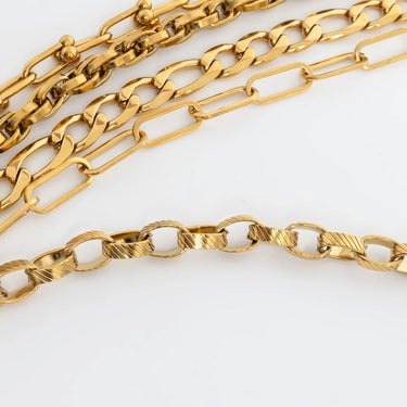 Gold chain necklaces on a white background