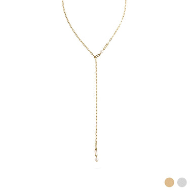 Gold lariat necklace on a white background