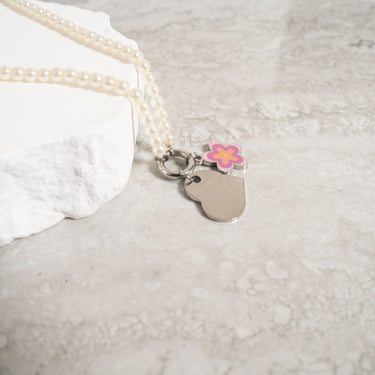 Polished Heart Pendant with flower charm on pearl necklace