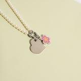Polished Heart Pendant with flower charm on pearl necklace