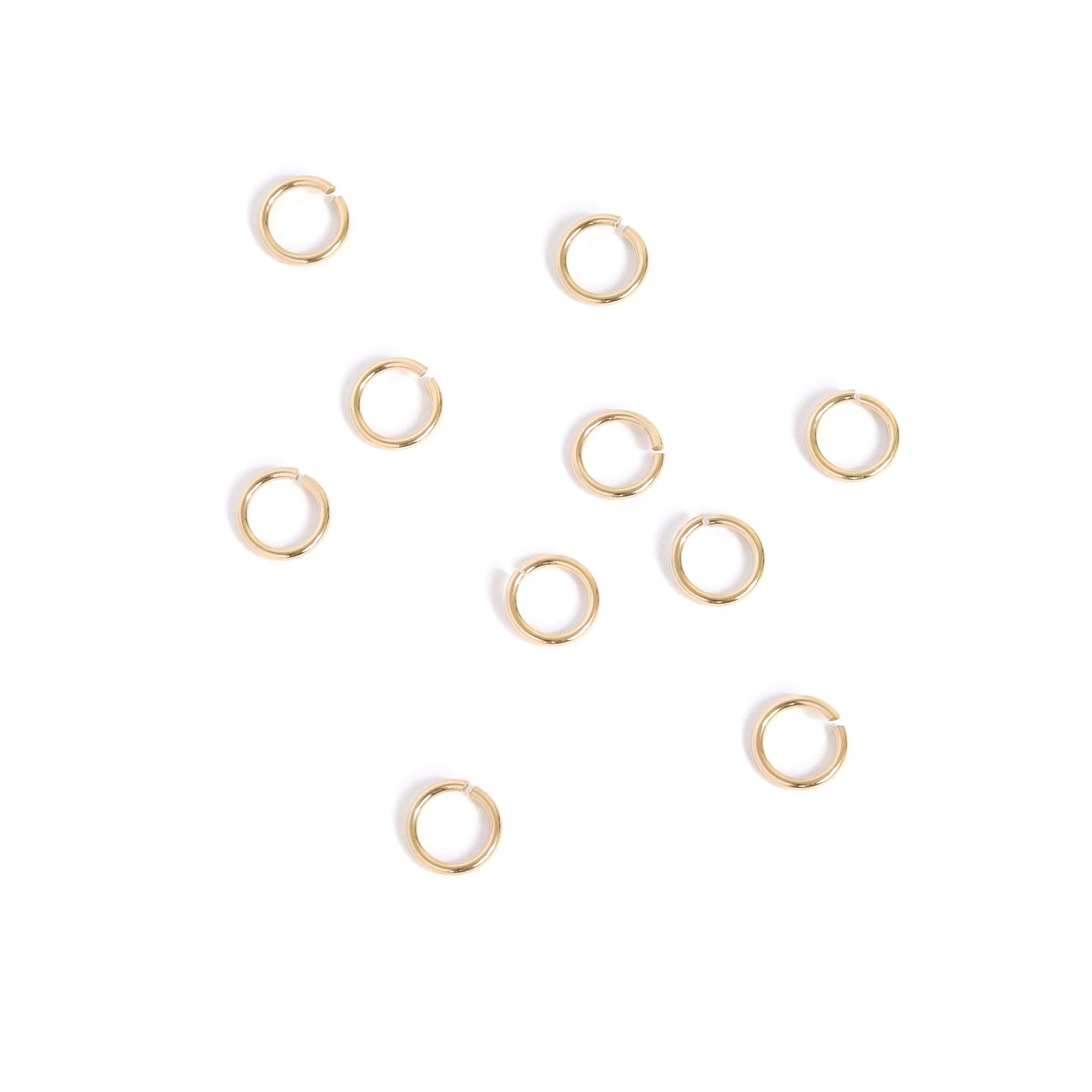 10-pack 10K solid guld öppna hoppringar / ENC0026