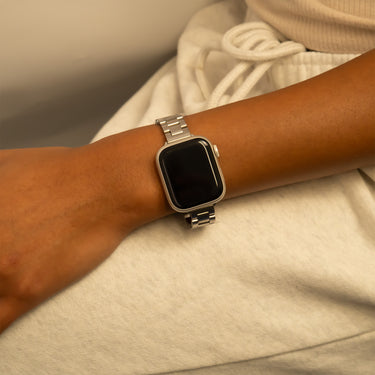 Smartwatch on a wrist with a neutral background