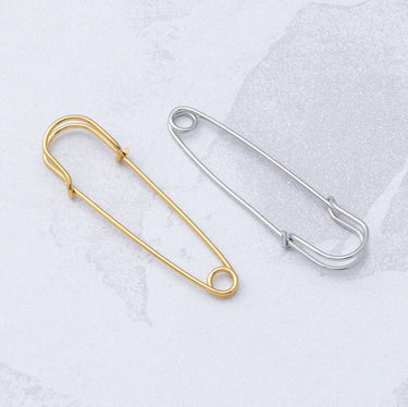 Gold and Silver Charm Brooches