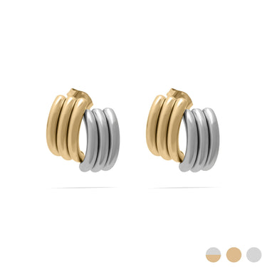 Pair of gold and silver hoop earrings on a white background