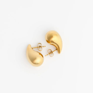 Gold teardrop-shaped earrings on a white background