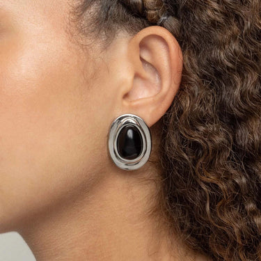 Close-up of an ear wearing a Black Enamel Stud Earrings