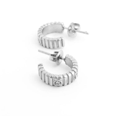 Silver hoop Fluted Huggie with Stones Earrings with a diamond on a white background