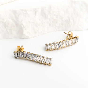 Gold and clear crystal bar-shaped earrings on a white background