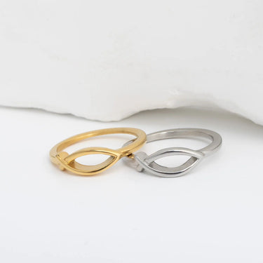 Gold and silver infinity ring on a white background