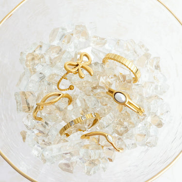 Gold rings on a bed of clear crystals