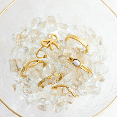 Gold rings on a bed of clear crystals